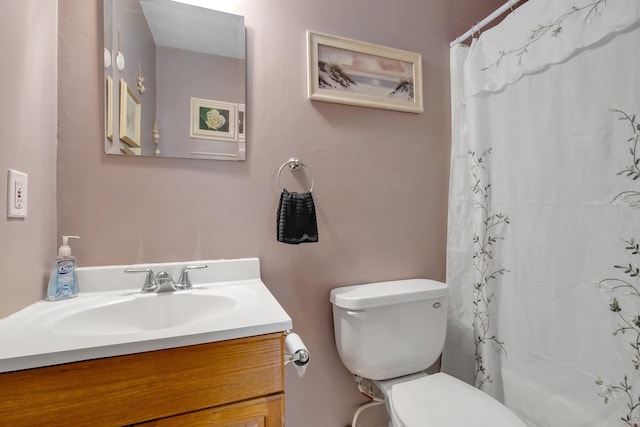 bathroom with vanity, toilet, and a shower with shower curtain