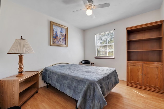 bedroom with ceiling fan and light hardwood / wood-style flooring