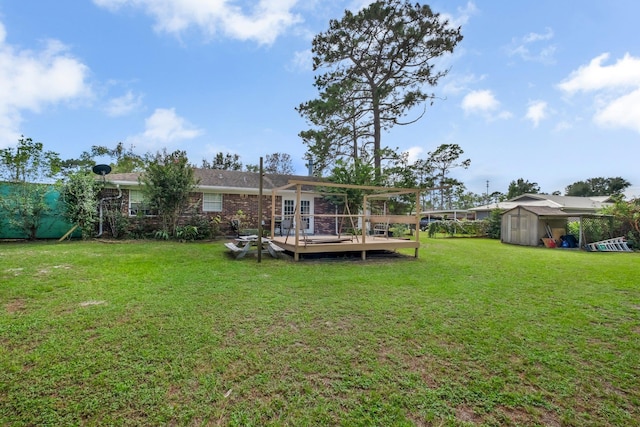 view of yard featuring a shed and a wooden deck