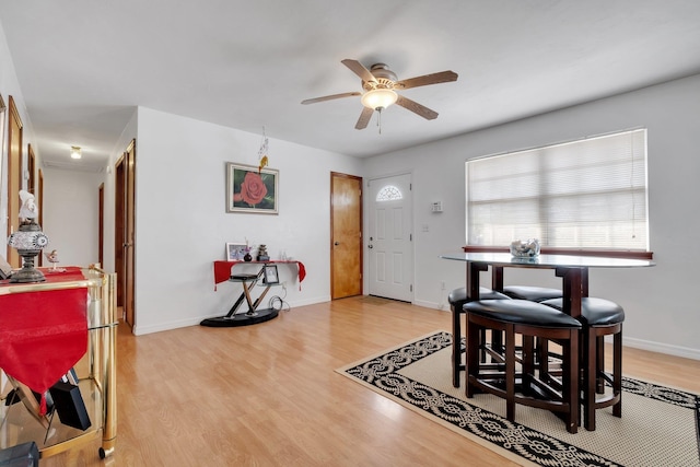 dining space featuring light hardwood / wood-style floors and ceiling fan