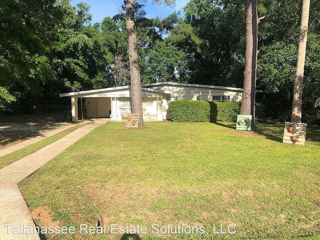 view of yard with a carport