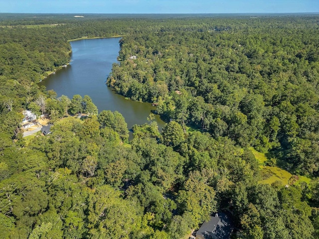 aerial view featuring a water view and a forest view