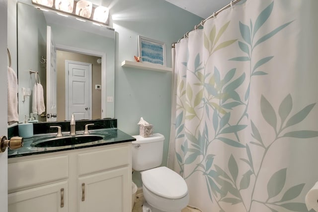full bath with a shower with shower curtain, toilet, and vanity