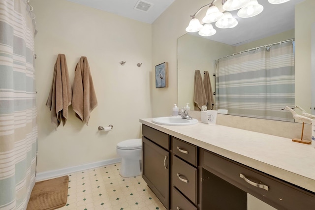 bathroom featuring visible vents, baseboards, toilet, tile patterned floors, and vanity