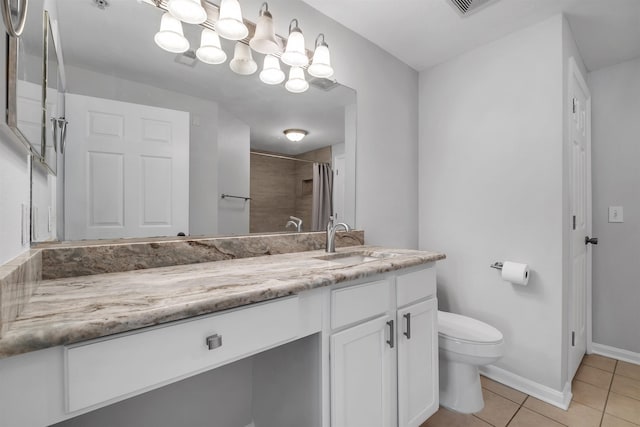 2801 Chancellorsville Dr Unit 1218, Tallahassee, FL 32312 - bathroom featuring toilet, vanity, tile patterned flooring, curtained shower, and baseboards