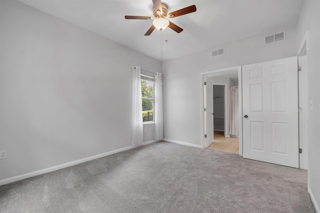 2801 Chancellorsville Dr Unit 1218, Tallahassee, FL 32312 - unfurnished bedroom with light colored carpet, baseboards, ceiling fan, and light tile patterned flooring