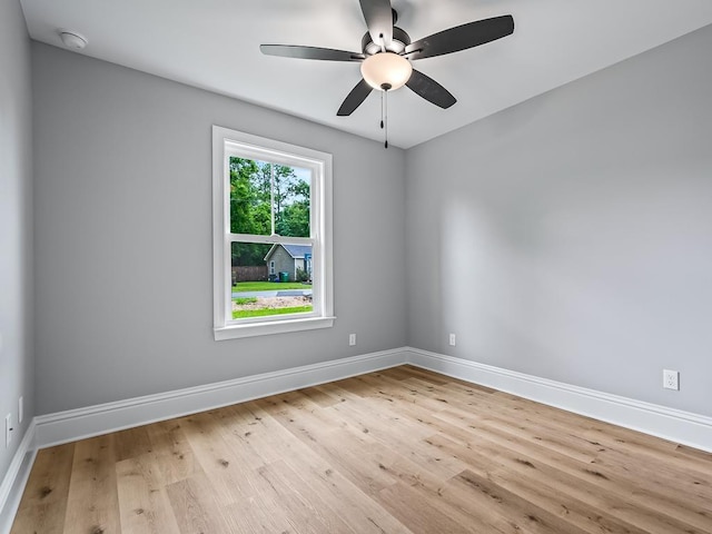 unfurnished room with ceiling fan and light wood-type flooring