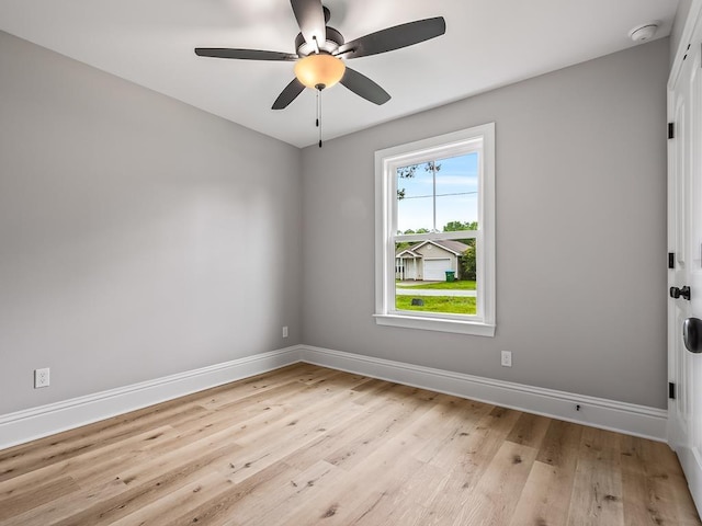 empty room featuring ceiling fan and light hardwood / wood-style flooring