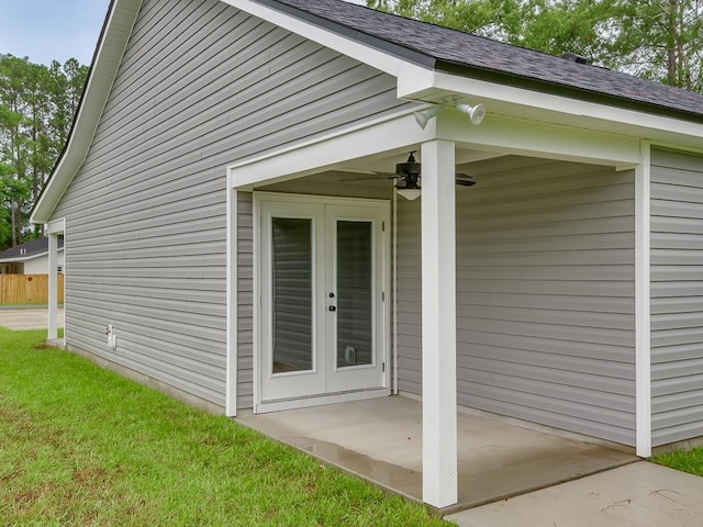 view of home's exterior featuring french doors, a yard, and a patio area