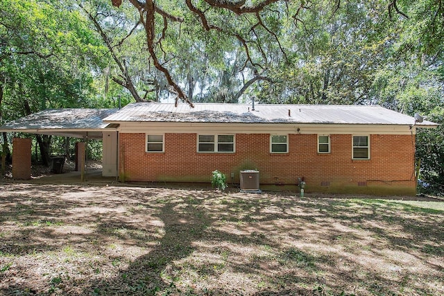 1318 W Tharpe St, Tallahassee, FL 32303 - back of house with crawl space, metal roof, cooling unit, and a carport