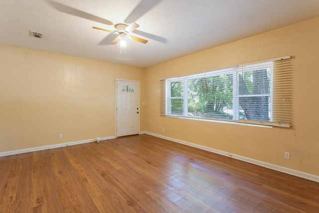 1318 W Tharpe St, Tallahassee, FL 32303 - spare room featuring a ceiling fan, wood finished floors, and baseboards