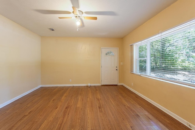 1318 W Tharpe St, Tallahassee, FL 32303 - spare room featuring wood finished floors, a ceiling fan, and baseboards