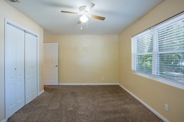 1318 W Tharpe St, Tallahassee, FL 32303 - unfurnished bedroom with carpet floors, a closet, baseboards, and a ceiling fan
