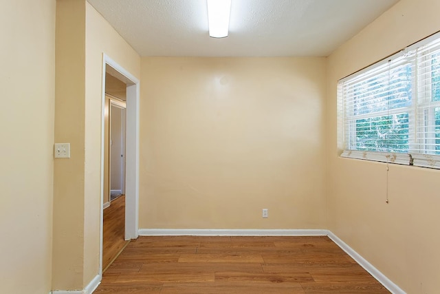 1318 W Tharpe St, Tallahassee, FL 32303 - spare room with light wood-style flooring and baseboards