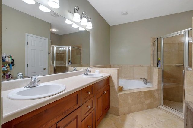 bathroom featuring shower with separate bathtub, vanity, and tile patterned floors