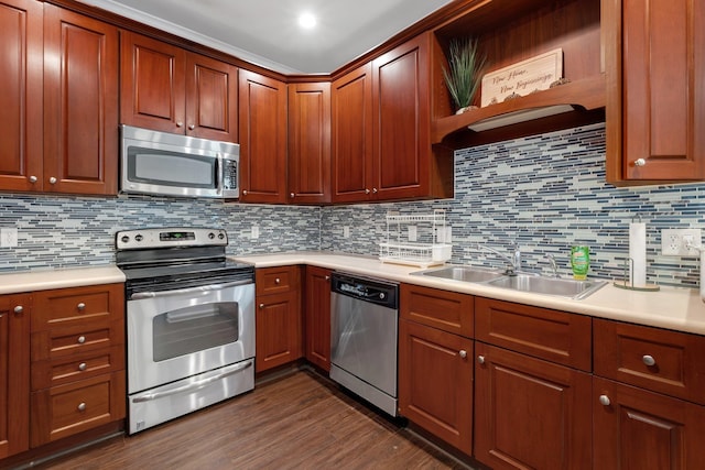 kitchen with decorative backsplash, sink, dark wood-type flooring, and appliances with stainless steel finishes