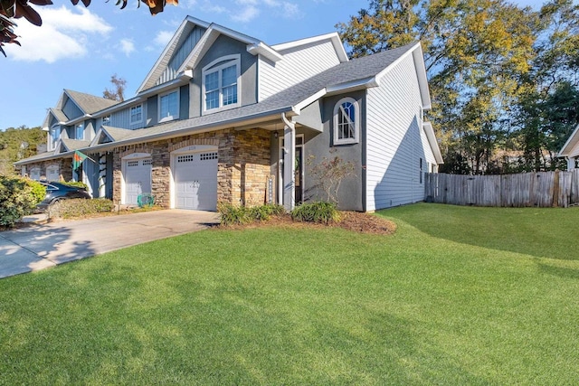 view of front of house with a front yard and a garage