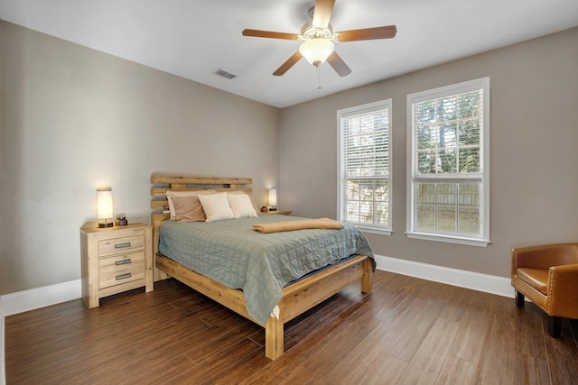 bedroom featuring dark hardwood / wood-style flooring and ceiling fan