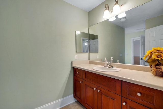 bathroom with tile patterned floors and vanity