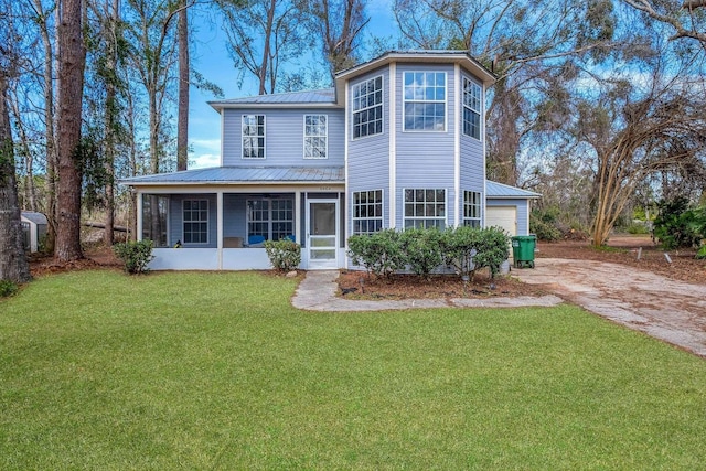 view of front of house with a garage and a front yard