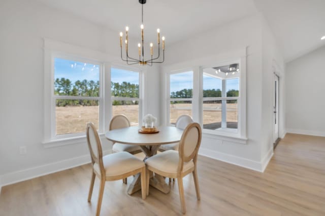 dining room featuring an inviting chandelier and light wood-type flooring