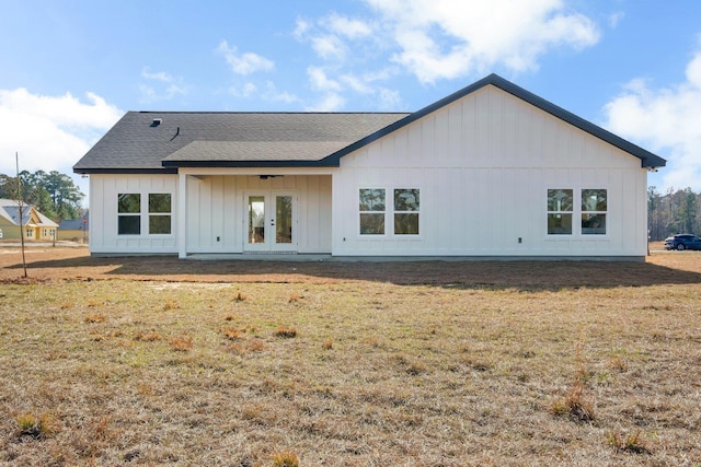 rear view of house with a yard and french doors