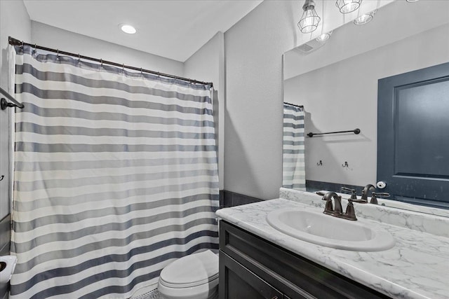 bathroom with vanity and toilet