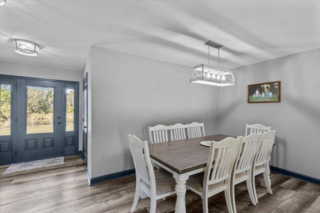 dining area featuring wood-type flooring