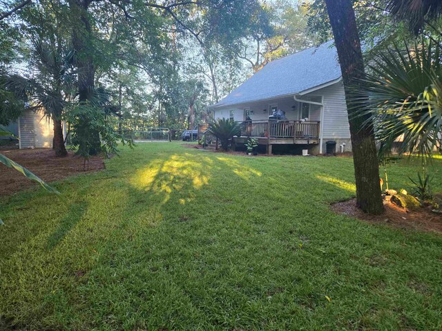 view of yard with a wooden deck