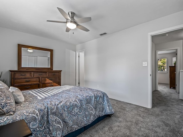 carpeted bedroom with ceiling fan