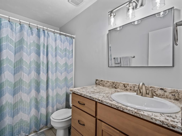 bathroom featuring vanity, toilet, curtained shower, and tile patterned flooring