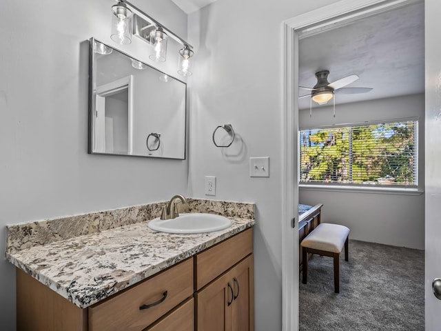 bathroom with ceiling fan and vanity