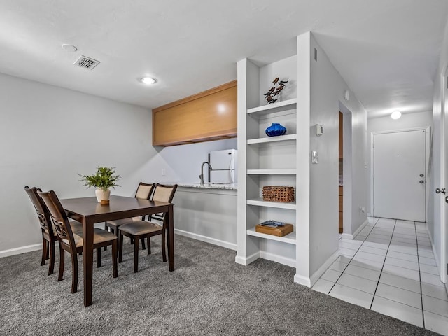 dining room with carpet flooring and sink