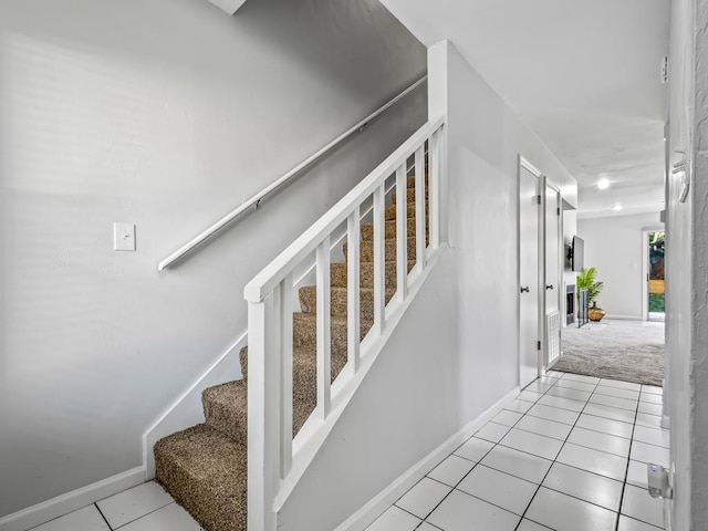 staircase with tile patterned floors