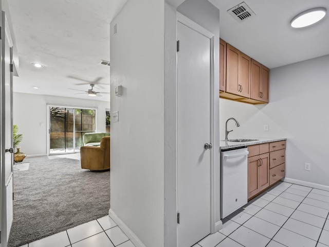 kitchen featuring light carpet, sink, dishwasher, and ceiling fan