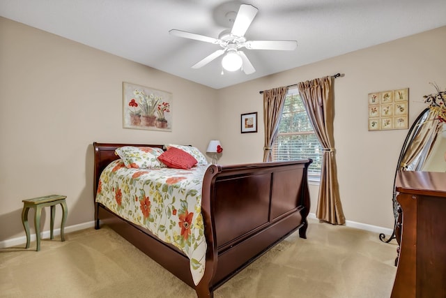 bedroom featuring light colored carpet and ceiling fan