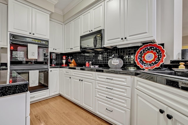 kitchen featuring black appliances, white cabinetry, ornamental molding, and light hardwood / wood-style flooring