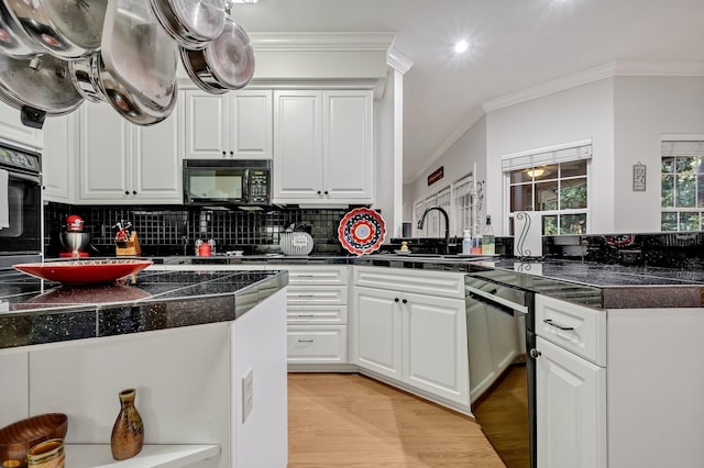 kitchen featuring crown molding, sink, black appliances, light hardwood / wood-style floors, and white cabinetry