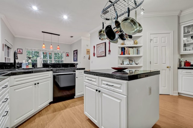 kitchen with light wood-type flooring, black dishwasher, white cabinetry, and crown molding