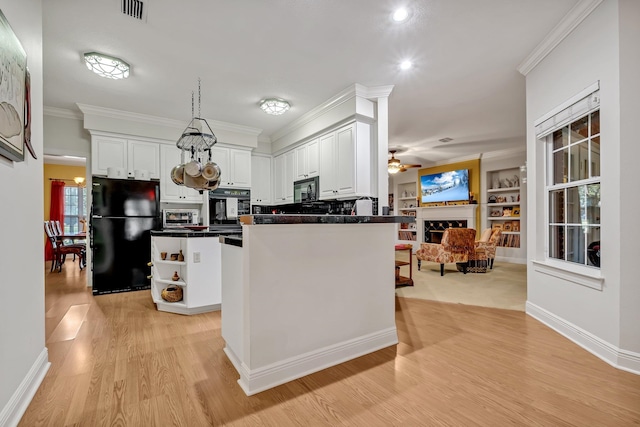 kitchen featuring black appliances, crown molding, light hardwood / wood-style flooring, ceiling fan, and white cabinetry