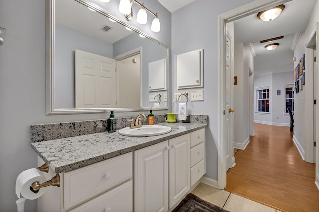 bathroom featuring vanity and wood-type flooring