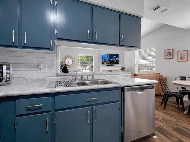 2490 Nugget Ln, Tallahassee, FL 32303 - kitchen with blue cabinetry, stainless steel appliances, and a sink