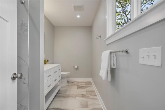 1602 Carruthers St, Tallahassee, FL 32308 - full bathroom with marble tiled flooring, baseboards, vanity, toilet, and recessed lighting