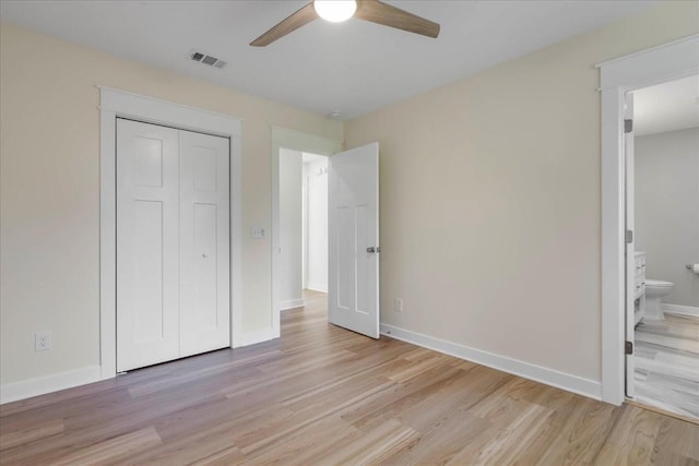 1602 Carruthers St, Tallahassee, FL 32308 - unfurnished bedroom featuring light wood-style floors, a closet, baseboards, and connected bathroom
