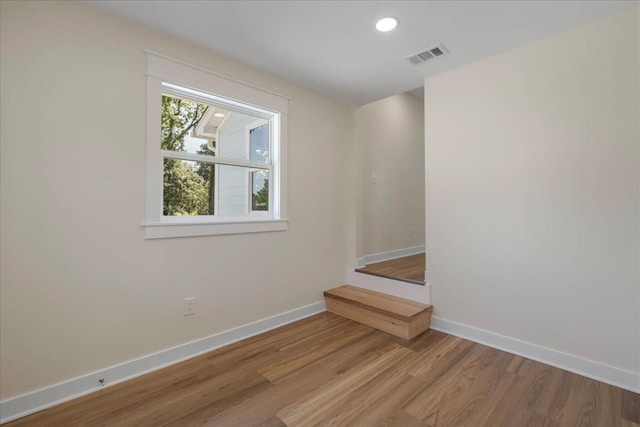 1602 Carruthers St, Tallahassee, FL 32308 - unfurnished room featuring baseboards, wood finished floors, and recessed lighting