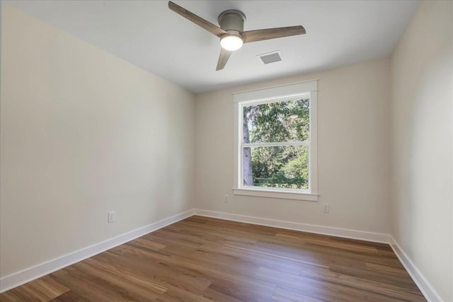 1602 Carruthers St, Tallahassee, FL 32308 - empty room featuring wood finished floors, a ceiling fan, and baseboards