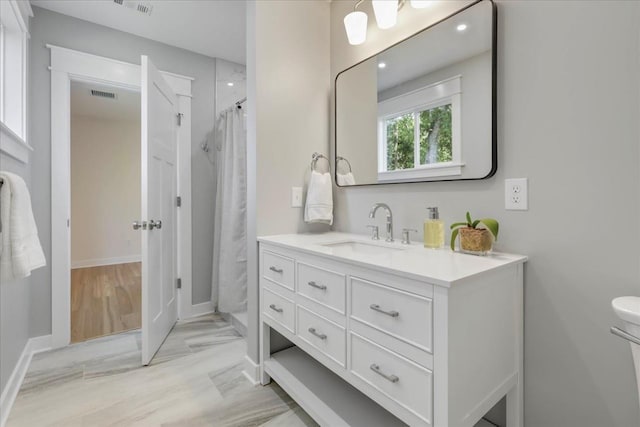 1602 Carruthers St, Tallahassee, FL 32308 - bathroom with vanity, baseboards, recessed lighting, a shower with curtain, and toilet