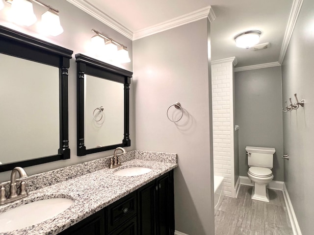 full bathroom with crown molding, toilet, vanity, and hardwood / wood-style flooring