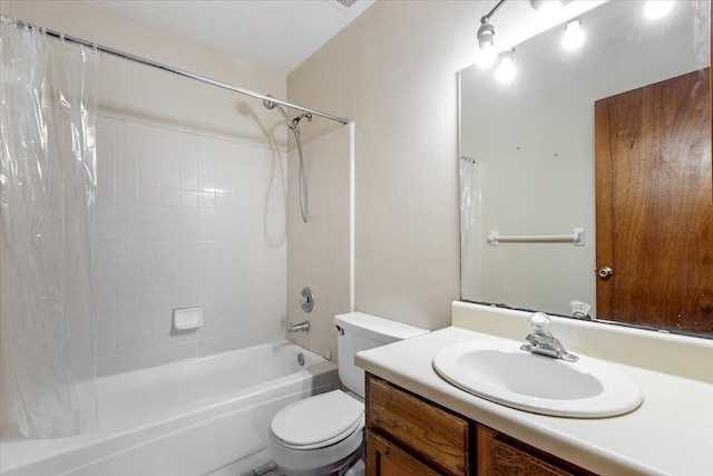 full bathroom with vanity, shower / bath combo, and toilet