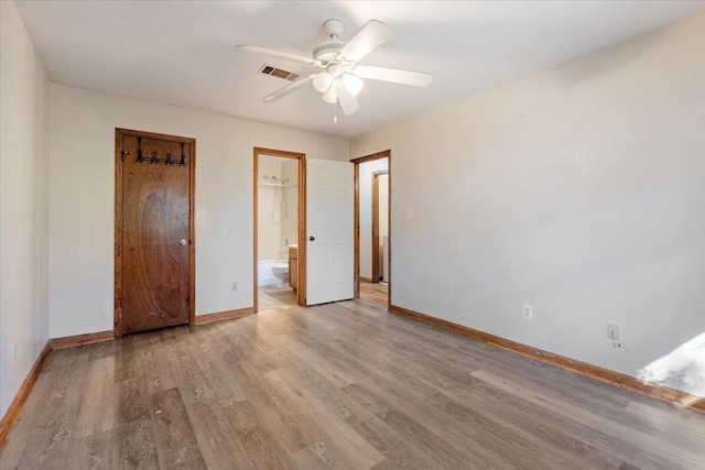 unfurnished bedroom with light hardwood / wood-style floors, ensuite bath, and ceiling fan